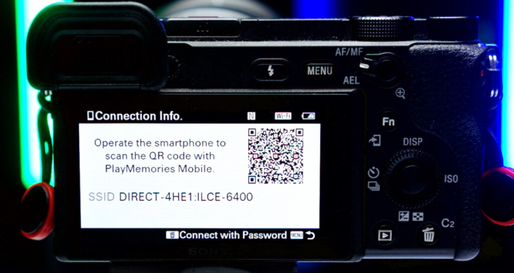 Photo of the backside of a Sony a6400. It shows the Wifi remote connection standby screen, which is dominated by a QR code to share the information required to connect to its Wifi hotspot.