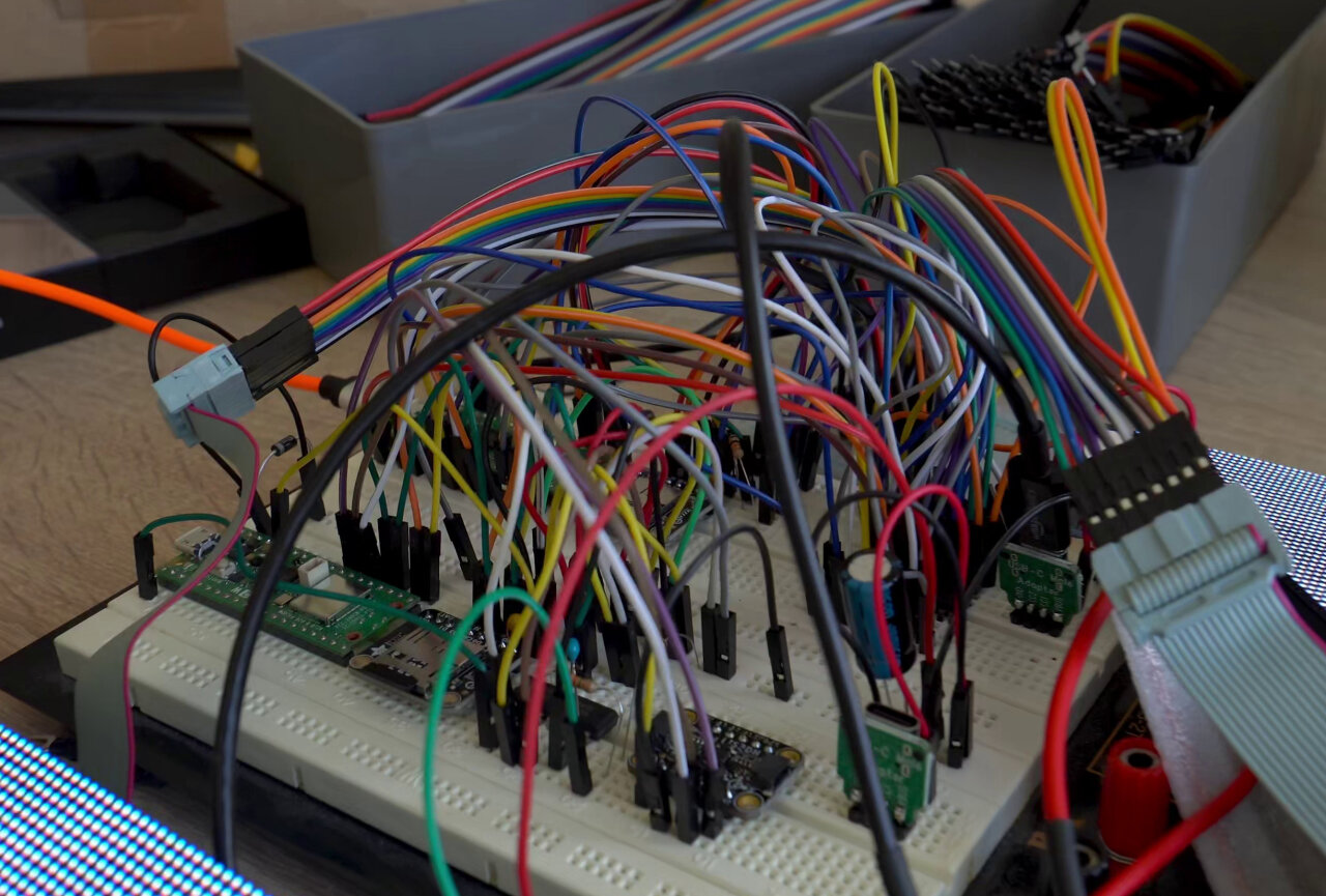 Photo of a breadboard with a massive amount of jumper cables.